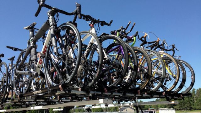 Pictures of bikes loaded on top of a van.