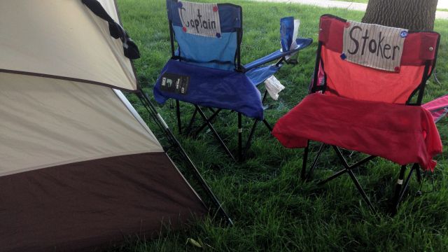 captain's chairs in front of tent