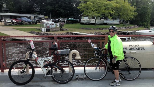 Bob on ferry with two bikes.
