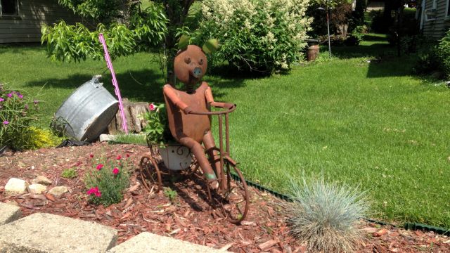 metal pig on an ornamental bicycle