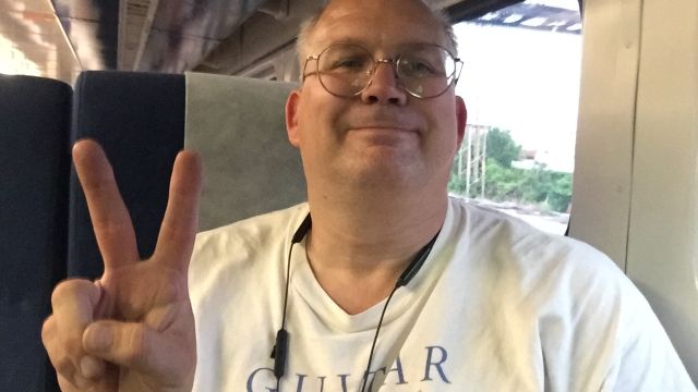 Paul posing on the train.