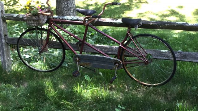 tandem bike on a fence