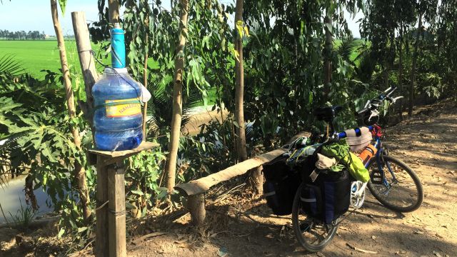 bicycle and water bottle in farming district