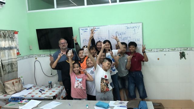 Paul with classroom of students.