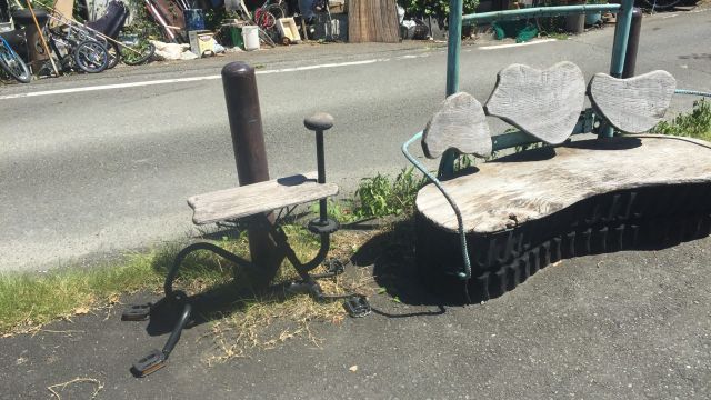 Bus stop bench made from stationary bike.