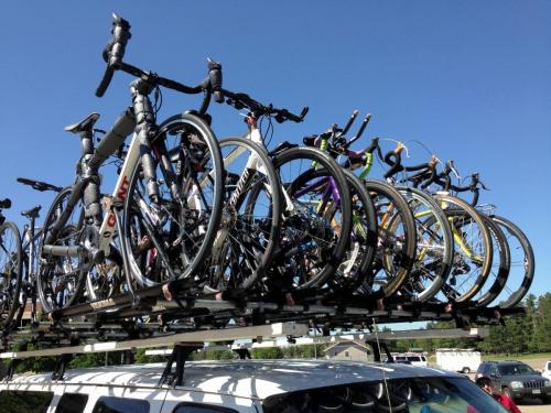 Pictures of bikes loaded on top of a van.