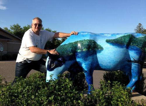 Paul holding horns of Babe the Blue Ox