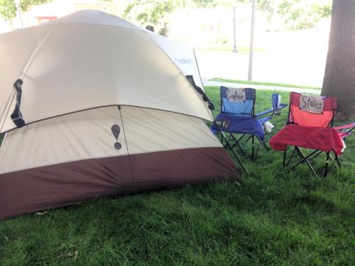 captain's chairs in front of tent