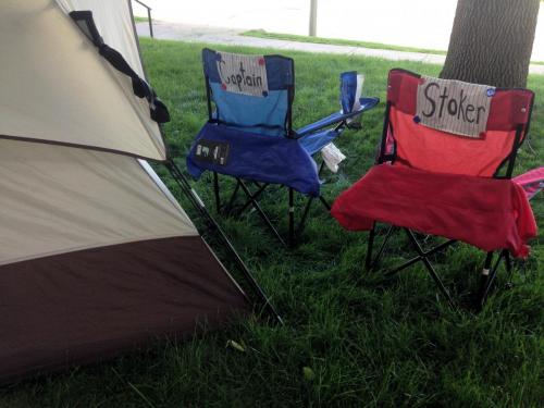 captain's chairs in front of tent