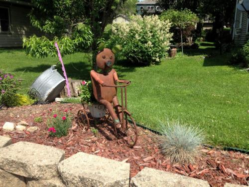 metal pig on an ornamental bicycle