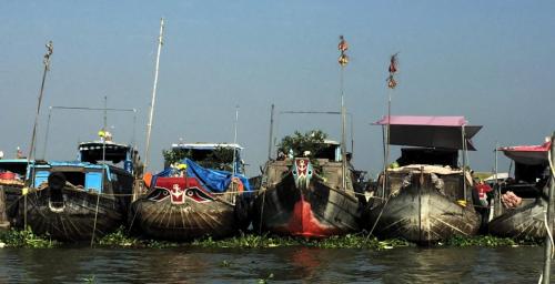 fishing boats lined up on river
