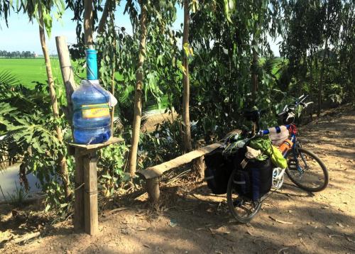 bicycle and water bottle in farming district