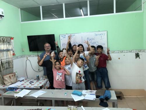 Paul with classroom of students.