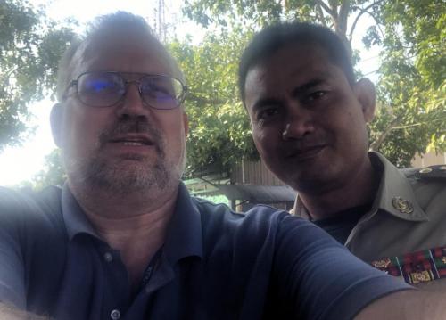Paul and Cambodian policeman.