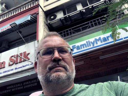 Paul in front of Family Mart in Ho Chi Minh City.